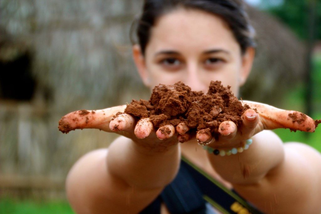 Natalie showing the rich organic soil in Vinales, Cuba